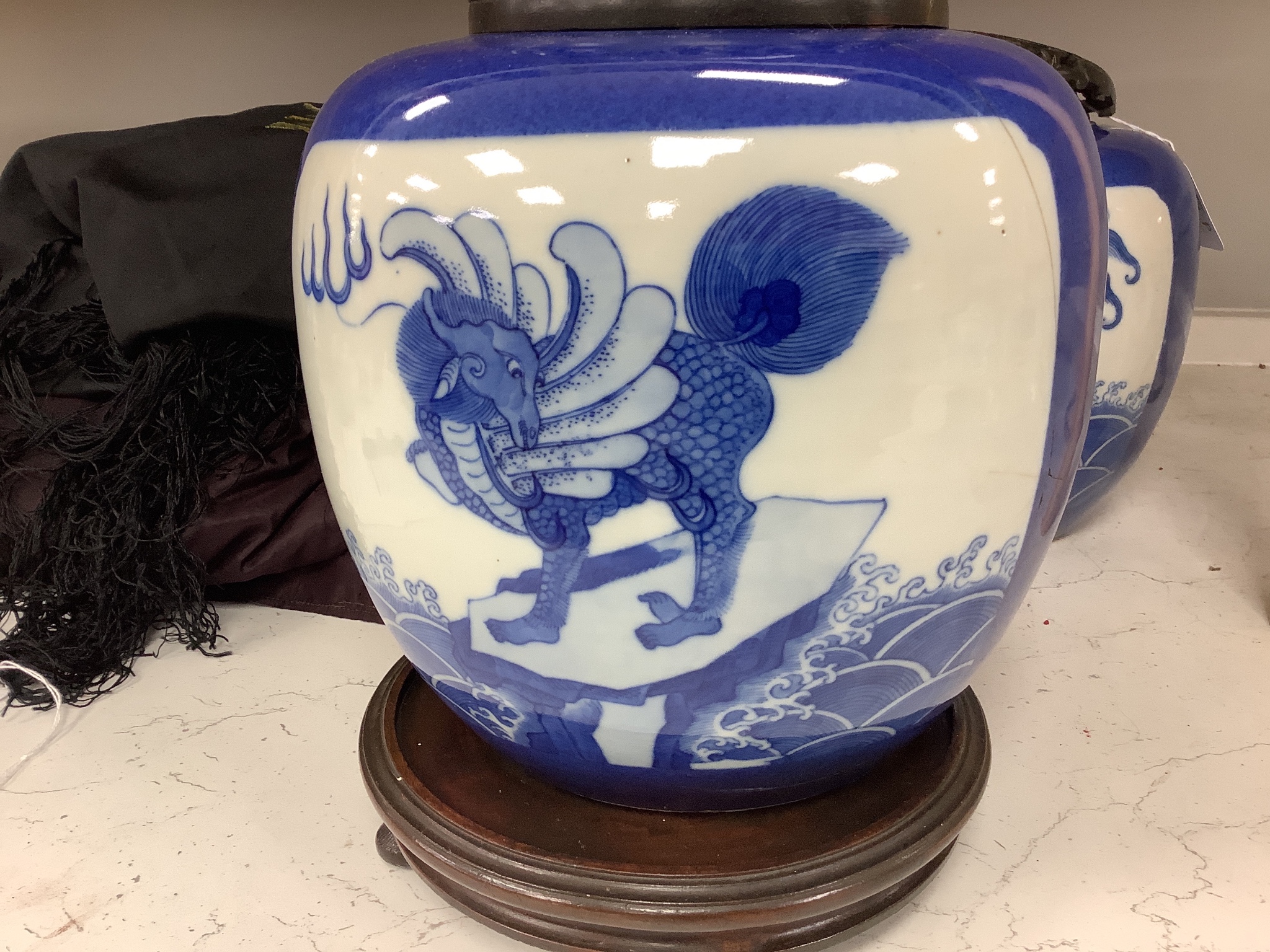 A pair of 19th century Chinese blue and white 'mythical beast' jars